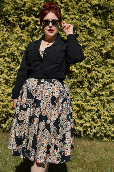 Plus size pinup Miss Amy May models the Ravenwood jackets by Hell Bunny for a fit and sizing review