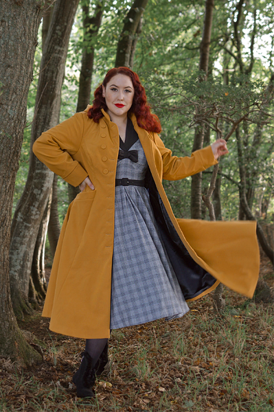 Plus size pinuo Miss Amy May models the Lucinda-Marigold coat by Miss Candyfloss for a fit and size review