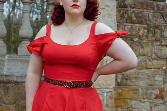 Plus size pinup Miss Amy May models the red Nancy dress by Hell Bunny for a fit and size review