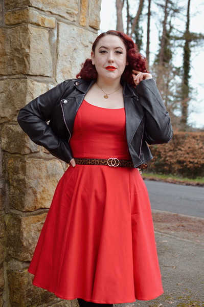 Plus size pinup Miss Amy May models the red Nancy dress by Hell Bunny for a fit and size review