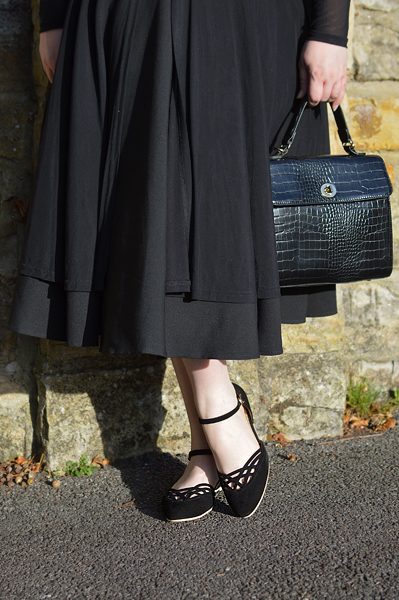 Miss Amy May models the black Serpente flats by Charlie Stone Shoes from the Dark Academia collection