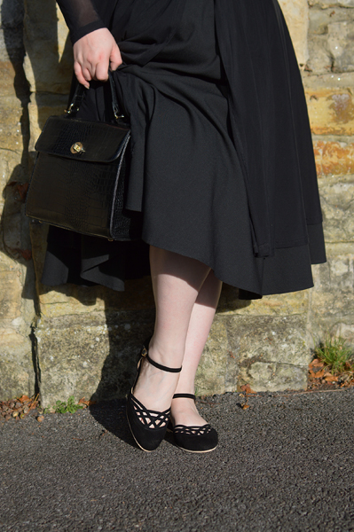 Miss Amy May models the black Serpente flats by Charlie Stone Shoes from the Dark Academia collection