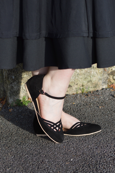Miss Amy May models the black Serpente flats by Charlie Stone Shoes from the Dark Academia collection