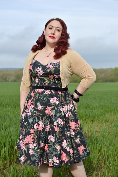 Plus size pinup Miss Amy May models the Calypso dress by Hell Bunny for a fit and sizing review