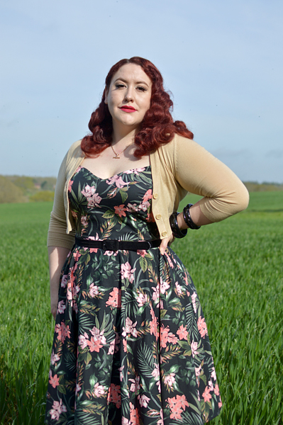 Plus size pinup Miss Amy May models the Calypso dress by Hell Bunny for a fit and sizing review