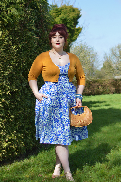 Plus size pinup Miss Amy May models the Sicily dress by Hell Bunny for a fit and size review