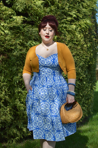 Plus size pinup Miss Amy May models the Sicily dress by Hell Bunny for a fit and size review