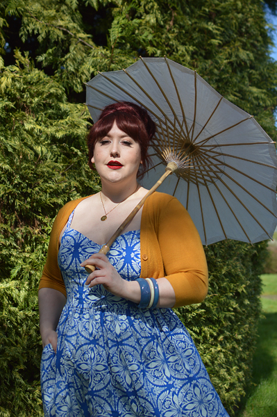 Plus size pinup Miss Amy May models the Sicily dress by Hell Bunny for a fit and size review