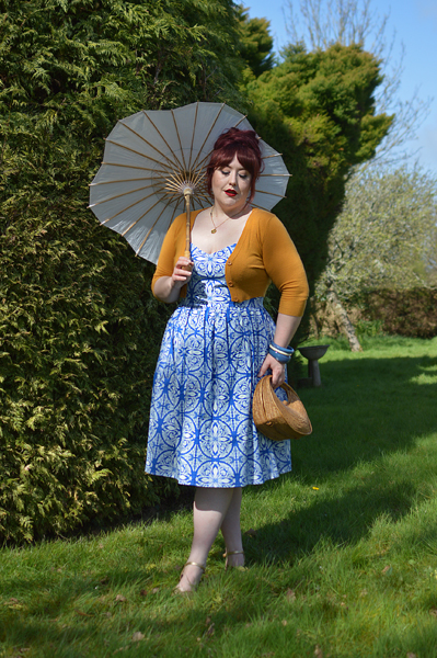 Plus size pinup Miss Amy May models the Sicily dress by Hell Bunny for a fit and size review