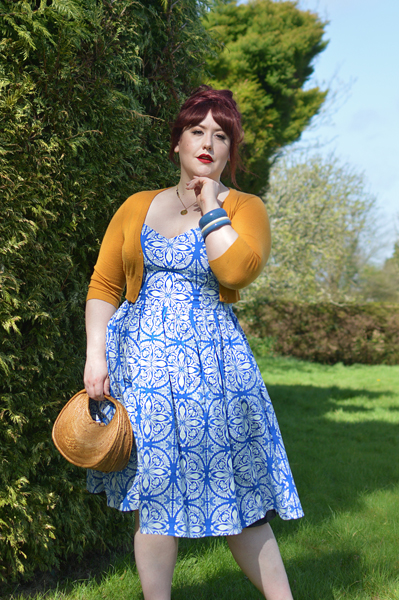 Plus size pinup Miss Amy May models the Sicily dress by Hell Bunny for a fit and size review