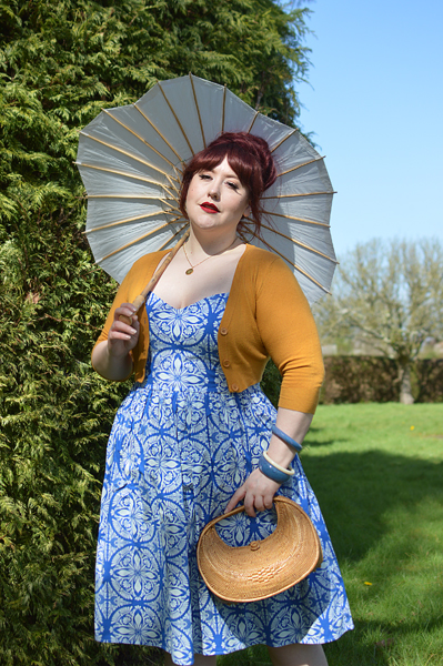 Plus size pinup Miss Amy May models the Sicily dress by Hell Bunny for a fit and size review