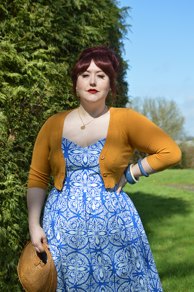 Plus size pinup Miss Amy May models the Sicily dress by Hell Bunny for a fit and size review
